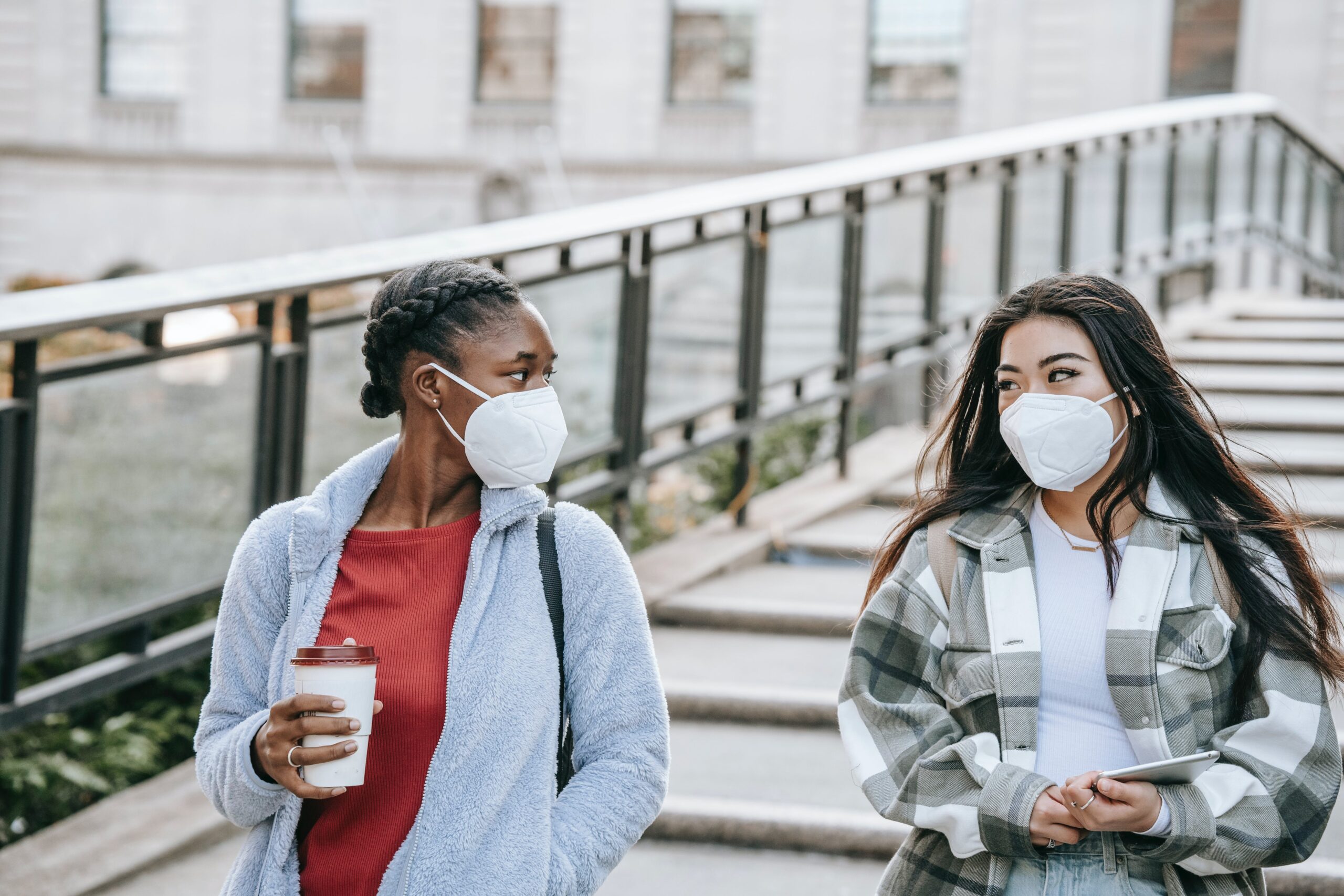 two ladies with masks